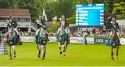 7 August 2015; The Winning Ireland team, from left to right, Darragh Kenny, Cian O'Connor, Greg Patrick Broderick, and Bertram Allen celebrate their victory in the Furusiyya FEI Nations Cup during the Discover Ireland Dublin Horse Show 2015. RDS, Ballsbridge, Dublin. Picture credit: Seb Daly / SPORTSFILE