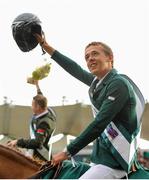 7 August 2015; Ireland's Bertram Allen waves to the crowd after Ireland won the Furusiyya FEI Nations Cup during the Discover Ireland Dublin Horse Show 2015. RDS, Ballsbridge, Dublin. Picture credit: Seb Daly / SPORTSFILE