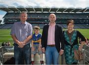 8 August 2015; Tipperary great Eoin Kelly in attendance at today's‚ Bord Gáis Energy Legends Tour at Croke Park, where he relived some of most memorable moments from his playing career, with the Cooneys from Clonmel, Co. Tipperary, Fintan, Keith, aged 6, and Marie. All Bord Gáis Energy Legends Tours include a trip to the GAA Museum, which is home to many exclusive exhibits, including the official GAA Hall of Fame. For booking and ticket information about the GAA legends for this summer visit www.crokepark.ie/gaa-museum. Croke Park, Dublin. Picture credit: Dáire Brennan / SPORTSFILE