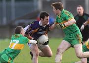 7 December 2008; Brian McGrath, Kilmacud Crokes, in action against Anton Sullivan, left, and Pascal Kellaghan, Rhode. AIB Leinster Senior Club Football Championship Final, Kilmacud Crokes v Rhode, Parnell Park, Dublin. Picture credit: Brian Lawless / SPORTSFILE
