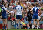 8 August 2015; Monaghan players remonstrate with referee Marty Duffy. GAA Football All-Ireland Senior Championship Quarter-Final, Monaghan v Tyrone, Croke Park, Dublin. Picture credit: Sam Barnes / SPORTSFILE