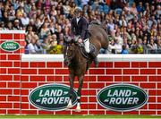 8 August 2015; Liam O'Meara, competing on Cisero, clearing the wall during the Land Rover Puissancein, during the Discover Ireland Dublin Horse Show 2015. RDS, Ballsbridge, Dublin. Picture credit: Matt Browne / SPORTSFILE