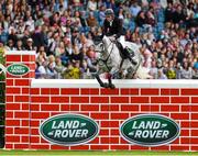 8 August 2015; Jason Higgins, competing on Hadine Van'T Zorgvliet, clearing the wall during the Land Rover Puissancein, during the Discover Ireland Dublin Horse Show 2015. RDS, Ballsbridge, Dublin. Picture credit: Matt Browne / SPORTSFILE