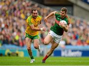 8 August 2015; Seamus O'Shea, Mayo, is pursued by Karl Lacey, Donegal. GAA Football All-Ireland Senior Championship Quarter-Final, Donegal v Mayo, Croke Park, Dublin. Picture credit: Sam Barnes / SPORTSFILE