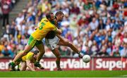 8 August 2015; Aidan O'Shea, Mayo, shoots to score his side's first goal despite the attention of Neil McGee, Donegal. GAA Football All-Ireland Senior Championship Quarter-Final. Donegal v Mayo, Croke Park, Dublin. Picture credit: Stephen McCarthy / SPORTSFILE