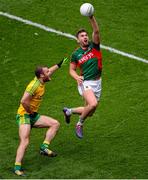 8 August 2015; Aidan O'Shea, Mayo, in action against Neil McGee, Donegal. GAA Football All-Ireland Senior Championship Quarter-Final, Donegal v Mayo, Croke Park, Dublin. Picture credit: Dáire Brennan / SPORTSFILE