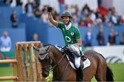 8 August 2015; Andres Rodriguez, from Venezuela, competing on Caballito celebrates after clearing the wall during the Land Rover Puissancein, during the Discover Ireland Dublin Horse Show 2015. RDS, Ballsbridge, Dublin. Picture credit: Matt Browne / SPORTSFILE
