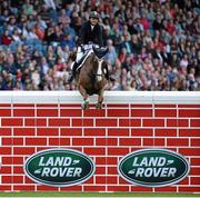 8 August 2015; Sameh El Dahan, from Egypt, competing on Seapatrick Cruise Cavalier, clears the wall to win the Land Rover Puissancein at the Discover Ireland Dublin Horse Show 2015. RDS, Ballsbridge, Dublin. Picture credit: Matt Browne / SPORTSFILE