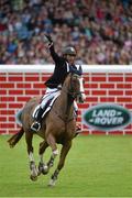 8 August 2015; Sameh El Dahan, from Egypt, competing on Seapatrick Cruise Cavalier, celebrates after winning the Land Rover Puissancein at the Discover Ireland Dublin Horse Show 2015. RDS, Ballsbridge, Dublin. Picture credit: Matt Browne / SPORTSFILE