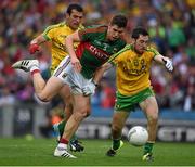 8 August 2015; Lee Keegan, Mayo, in action against Mark McHugh, 12, and Frank McGlynn, Donegal. GAA Football All-Ireland Senior Championship Quarter-Final, Donegal v Mayo, Croke Park, Dublin. Picture credit: Ray McManus / SPORTSFILE
