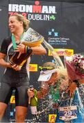 9 August 2015; Susie Cheetham, left, Great Britain, celebrates with third place, Sonja Tajisich, Germany, after fighting off stiff competition to take the gold medal at today’s inaugural IRONMAN 70.3 Dublin. Dublin City Council hosted the competition which saw over 2500 athletes complete a 1.2 mile swim in Scotsman’s Bay in Dun Laoghaire, before mounting their bikes to travel through Dublin and west of the city for a 56 mile cycle, to return to the Phoenix Park for the 13.1 mile half-marathon.    1,500 Irish athletes took part in today’s event and 1,000 international athletes from 40 countries travelled to Dublin to compete in the gruelling competition. Chesterfield Avenue, Phoenix Park, Dublin. Picture credit: David Maher / SPORTSFILE