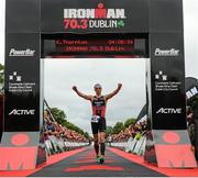 9 August 2015; Kevin Thornton, Ireland, finishes third at today’s inaugural IRONMAN 70.3 Dublin. Dublin City Council hosted the competition which saw over 2500 athletes complete a 1.2 mile swim in Scotsman’s Bay in Dun Laoghaire, before mounting their bikes to travel through Dublin and west of the city for a 56 mile cycle, to return to the Phoenix Park for the 13.1 mile half-marathon.    1,500 Irish athletes took part in today’s event and 1,000 international athletes from 40 countries travelled to Dublin to compete in the gruelling competition. Chesterfield Avenue, Phoenix Park, Dublin. Picture credit: David Maher / SPORTSFILE