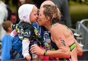 9 August 2015; Second place Samantha Warriner, New Zealand, celebrates with her daughter Lola-Rose, age 3, at today’s inaugural IRONMAN 70.3 Dublin. Dublin City Council hosted the competition which saw over 2500 athletes complete a 1.2 mile swim in Scotsman’s Bay in Dun Laoghaire, before mounting their bikes to travel through Dublin and west of the city for a 56 mile cycle, to return to the Phoenix Park for the 13.1 mile half-marathon.    1,500 Irish athletes took part in today’s event and 1,000 international athletes from 40 countries travelled to Dublin to compete in the gruelling competition. Chesterfield Avenue, Phoenix Park, Dublin. Picture credit: David Maher / SPORTSFILE