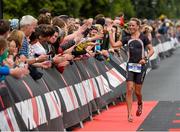 9 August 2015;  Susie Cheetham, Great Britain, fought off stiff competition to take the gold medal at today’s inaugural IRONMAN 70.3 Dublin. Dublin City Council hosted the competition which saw over 2500 athletes complete a 1.2 mile swim in Scotsman’s Bay in Dun Laoghaire, before mounting their bikes to travel through Dublin and west of the city for a 56 mile cycle, to return to the Phoenix Park for the 13.1 mile half-marathon.    1,500 Irish athletes took part in today’s event and 1,000 international athletes from 40 countries travelled to Dublin to compete in the gruelling competition. Chesterfield Avenue, Phoenix Park, Dublin. Picture credit: David Maher / SPORTSFILE