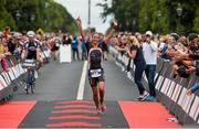 9 August 2015;  Susie Cheetham, Great Britain, fought off stiff competition to take the gold medal at today’s inaugural IRONMAN 70.3 Dublin. Dublin City Council hosted the competition which saw over 2500 athletes complete a 1.2 mile swim in Scotsman’s Bay in Dun Laoghaire, before mounting their bikes to travel through Dublin and west of the city for a 56 mile cycle, to return to the Phoenix Park for the 13.1 mile half-marathon.    1,500 Irish athletes took part in today’s event and 1,000 international athletes from 40 countries travelled to Dublin to compete in the gruelling competition. Chesterfield Avenue, Phoenix Park, Dublin. Picture credit: David Maher / SPORTSFILE