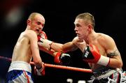 18 December 2008; Jason Booth lands a punch on Sean Hughes during their Comonwealth Bantamweight Title. Frank Maloney promotions, Jason Booth v Sean Hughes, The Helix, DCU, Dublin. Picture credit: Ray Lohan / SPORTSFILE *** Local Caption ***