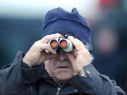 21 December 2008; Racing fan John Quirke, from Marlhill, New Inn, Co. Tipperary, watches the Holy Cross Novice Handicap Hurdle. Thurles Racecourse, Thurles, Co. Tipperary. Picture credit: Matt Browne / SPORTSFILE