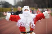 25 December 2008; Santa makes his way down the home straight after 'competing' in one of the many Goal Miles at the athletics track in UCD, Belfield, Dublin. This year the event took place at 72 locations around Ireland. Annual Goal Mile, Belfield, University College, Dublin. Picture credit: Ray McManus / SPORTSFILE