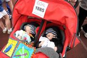 25 December 2008; 13 month old twins Liam and Conor Young, from Monkstown, Dublin, after their parents had ran one of the many Goal Miles at the athletics track in UCD, Belfield, Dublin. This year the event took place at 72 locations around Ireland. Annual Goal Mile, Belfield, University College, Dublin. Picture credit: Ray McManus / SPORTSFILE