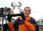 26 December 2008; Jockey John Cullen celebrates with the trophy after his mount Follow The Plan had won the Durkan New Homes Novice Steeplechase. Leopardstown Christmas Festival, Leopardstown Racecourse, Dublin. Picture credit: Pat Murphy / SPORTSFILE