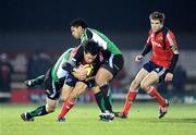 28 December 2008; Doug Howlett, Munster, is tackled by Liam Bibo, left, and Niva Ta'auso, Connacht. Magners League, Connacht v Munster, Sportsground, Galway. Picture credit: Brendan Moran / SPORTSFILE