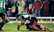 28 December 2008; Ian Keatley, Connacht, is tackled by Keith Earls and Peter Stringer, Munster. Magners League, Connacht v Munster, Sportsground, Galway. Picture credit: Brendan Moran / SPORTSFILE