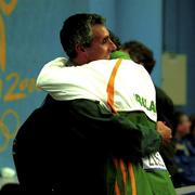 25 September 2000; Sonia O'Sullivan of Ireland embraces her partner Nick Bideau in the mixed zone after winning a silver medal in the women's 5000m race during the day 11 of the 2000 Sydney Olympics in Sydney, Australia. Photo by Brendan Moran/Sportsfile