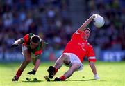 24 September 2000; Kieran Murphy of Cork in action against Edmond Barrett of Mayo during the All Ireland Minor Football Championship Final match between Cork and Mayo at Croke Park in Dublin. Photo by Ray McManus/Sportsfile
