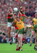 29 September 1996; Jimmy McGuinness, Meath wins the ball from Colm McManaman, left, and James Horan, Mayo, Meath v Mayo, All-Ireland Football Final replay, Croke Park, Co. Dublin. Picture credit; Ray McManus/SPORTSFILE