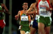 27 September 2000; Mark Carroll of Ireland, left, crosses the line to finish 7th in the Men's 5000m heat during day 13 of the Sydney Olympics in Sydney, Australia. Photo by Brendan Moran/Sportsfile