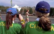 28 September 2000; Gillian O'Sullivan from Kerry, Ireland is cheered on Kerry supporters in the women's 20km walking race during day 14 of the 2000 Sydney Olympics in Sydney, Australia. Photo by Brendan Moran/Sportsfile