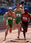 29 September 2000; Robert Daly, left, of Ireland receives the baton from team-mate Tomas Coman in the 4x400m heats during day 15 of the 2000 Sydney Olympics in Sydney, Australia. Photo by Brendan Moran/Sportsfile