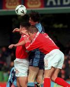 1 October 2000; Clive Delaney of UCD in action against Davy Byrne, left, and Richie Baker of Shelbourne during the Eircom League Premier Division match between UCD and Shelbourne at the Belfield Bowl in UCD, Dublin. Photo by David Maher/Sportsfile