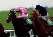 16 September 2000; Love Me True, with Seamus Heffernan up, right, races next to Snowflake, with Colm O'Donoghue up, in the Loder European Breeders Fund Fillies race during racing from the Curragh in Kildare. Photo by Matt Browne/Sportsfile