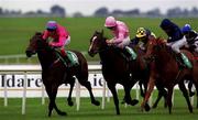 16 September 2000; Katherine Seymour, with Eddie Ahern up, left, races past Love Me True, with Seamus Heffernan up, in the Loder European Breeders Fund Fillies race during racing from the Curragh in Kildare. Photo by Matt Browne/Sportsfile
