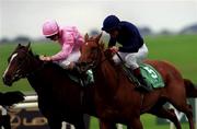 16 September 2000; Love Me True, with Seamus Heffernan up, right, races next to Snowflake, with Colm O'Donoghue up, in the Loder European Breeders Fund Fillies race during racing from the Curragh in Kildare. Photo by Matt Browne/Sportsfile