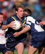 5 October 2000; Craig Bradley of Australia in action against Mick Casey of Dublin All-Stars during the International Rules Preliminary Match between Dublin All-Stars and Australia at Parnell Park in Dublin. Photo by Aoife Rice/Sportsfile