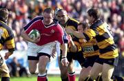 7 October 2000; Mick Galwey of Munster is tackled by Newport players, from left, Simon Raiwalui, Darren Edwards and Matt Pini during the Heineken Euopean Cup Pool 4 Round 1 match between Munster and Newport at Thomond Park in Limerick. Photo by Matt Browne/Sportsfile
