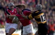 7 October 2000; Ronan O'Gara of Munster is tackled by Andy Marinos of Newport during the Heineken Euopean Cup Pool 4 Round 1 match between Munster and Newport at Thomond Park in Limerick. Photo by Matt Browne/Sportsfile