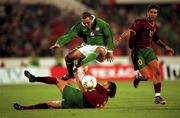 7 October 2000; Stephen Carr of Republic of Ireland evades the tackle from Dimas, bottom, and Rui Costa of Portugal during the World Cup 2002 Qualification Group 2 match between Portugal and Republic of Ireland at the Estádio da Luz in Lisbon, Portugal. Photo by David Maher/Sportsfile