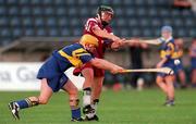 12 August 2000; Emily Hayden, Tipperary attempts to block down Collette Nevin, Galway, All Ireland Camogie Semi Final, Tipperary v Galway, Parnell Park, Dublin. Picture credit; David Maher/SPORTSFILE