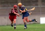 12 August 2000; Emily Hayden, Tipperary clears ahead of Sandra Tanian, Galway, All Ireland Camogie Semi Final, Tipperary v Galway, Parnell Park, Dublin. Picture credit; David Maher/SPORTSFILE