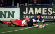 13 October 2000; Shane Horgan of Leinster scores a try despite the tackle from Nicholas Couttet of Biarritz during the Heineken Cup Pool 1 match between Leinster and Biarritz at Donnybrook Stadium in Dublin. Photo by Brendan Moran/Sportsfile
