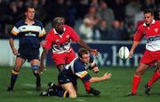 13 October 2000; Denis Hickie of Leinster releases the ball under pressure during the Heineken Cup Pool 1 match between Leinster and Biarritz at Donnybrook Stadium in Dublin. Photo by Brendan Moran/Sportsfile