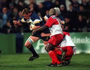 13 October 2000; Robert Casey of Leinster breaks through the tackle from Betsen Serge of Biarritz during the Heineken Cup Pool 1 match between Leinster and Biarritz at Donnybrook Stadium in Dublin. Photo by Brendan Moran/Sportsfile