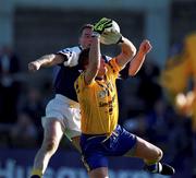 14 October 2000; Mick Galvin of Na Fianna in action against John O'Callaghan of Kilmacud Crokes during the Evening Herald Dublin Senior Football Championship Final match between Na Fianna and Kilmacud Crokes at Parnell Park in Dublin. Photo by Ray McManus/Sportsfile