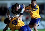 14 October 2000; Nigel Clancy of Kilmacud Crokes tussles with Kieran McGeeney, left, and Jason Sherlock of Na Fianna during the Evening Herald Dublin Senior Football Championship Final match between Na Fianna and Kilmacud Crokes at Parnell Park in Dublin. Photo by Ray McManus/Sportsfile