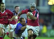 14 October 2000; Mike Mullins of Munster is tackled by Guillaumme Delmotte of Castres during the Heineken Cup Pool 1 match between Castres and Munster at the Stade Pierre Antoine in Castres, France. Photo by Matt Browne/Sportsfile