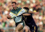 15 October 2000; Colm McManaman of Ireland in action against Chris Heffernan of Australia during the International Rules Series Second Test match between Ireland and Australia at Croke Park in Dublin. Photo by Brendan Moran/Sportsfile