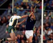 15 October 2000; DJ Carey of Ireland in action against Ian Borthwick of Scotland during the Hurling Shinty International match between Ireland and Scotland at Croke Park in Dublin. Photo Ray McManus/Sportsfile